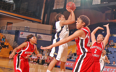 Senior guard Jamilah Humes goes up for two against Northern Illinois University Wednesday. The Flashes won in overtime 56 to 54. Photo by Matt Hafley.