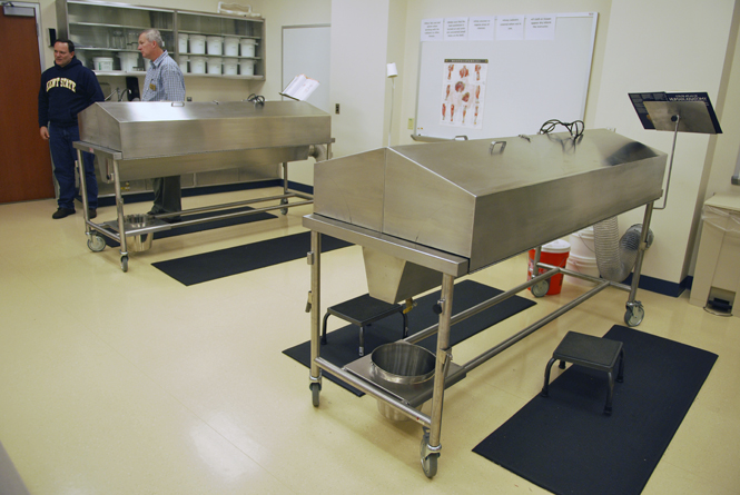 Mike Blake, technology program director, and Gary Misich, academic laboratory manager, stand next to cadavers at the Kent State Ashtabula campus. The cadaver lab is the only one within all of the Kent State campuses. Photo by Philip Botta.