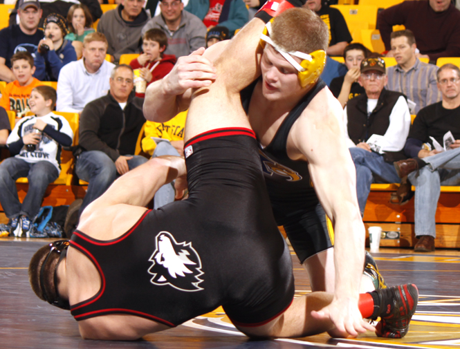 Junior Dustin Kilgore grapples his opponent in Kent State's match against Northern Illinois on Jan. 21. Kilgore faces the defending MAC Champion on Friday. Photo by Jessica Yanesh.