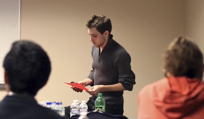 Christopher Clevenger, freshman electronic media major and member of Delta Lambda Phi, speaks to a group of students about being an ally to fellow students in Centennial B on Wednesday. Photo by Coty Giannelli