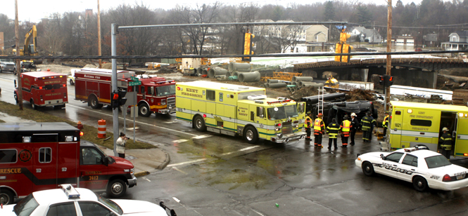 Kent Police and fire units respond to a flipped-over car at the corner of Crain Avenue and Lake Street Wednesday. The five teenagers involved in the accident were rushed to the hospital. No injuries were fatal. Photo by Nikolas Kolenich.