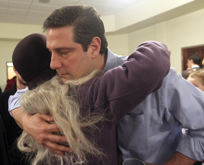 Sally Burnell, of Kent, a public employee at the Akron Summit County Library, hugs Congressman Tim Ryan at the Rally to Save Ohio’s Middle Class on Monday. Burnell is two years from retirement and fears that her pension funds will be reduced. Photo by Philip Botta