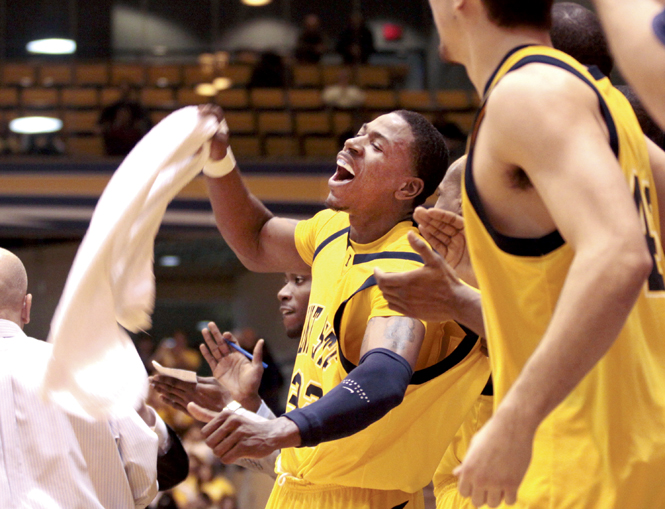 Senior guard Rod Sherman cheers from the bench during the Akron game last season. Tonight's game will be Sherman's last game at the M.A.C. Center. Photo by Rachel Kilroy