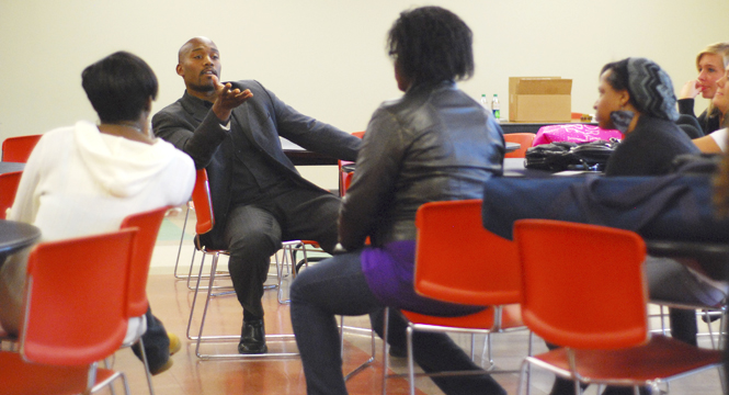 Speaker and author Hasani Pettiford talks to Kent State students on race, dating, sex and marriage. “Today is built on yesterday, and tomorrow is built on today,” said Pettiford. Author of eight books including Why We Hate Black Women, and Why We Should Love Them and Black Thighs, Black Guys &amp; Bedroom Lies, has spent 12 years learning about the intricacies of relationships and traveling speaking on why it is important to build a strong emotional and intellectual relationship before having sex. Photo by Sam Verbulecz.