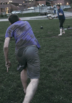 Trae Ruscin (right), senior general studies and LGBT studies minor, plays Spud with Christopher Clevenger, sophmore electronic media management major, out on Manchester field on Monday. PRIDE!Kent will be hosting events all week in honor of pride week. Photo by Valerie Brown.