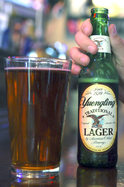 Bryan Staul, 21-year-old junior political science major, enjoyed drinking Yuengling — which debuted in Ohio this week — at Ray's Place in downtown Kent on Thursday, Oct. 6. "Everyone in my hometown drinks it," said Staul, who is from Pennsylvania. Photo by Monica Maschak.