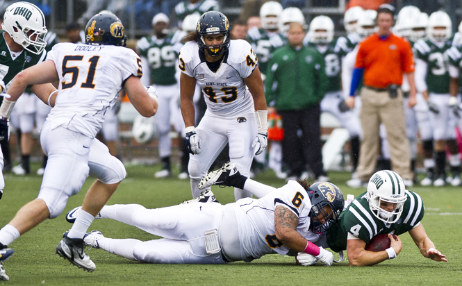 Ohio's Tyler Tettleton dives for extra yards against the Kent State defense at Peden Stadium, Athens, OH, on October 1, 2011. Tettleton amased 20 yards on the ground, and 276 yards through the air leading the Bobcats to their 17-10 win. Photo by Jason Edward Chow.