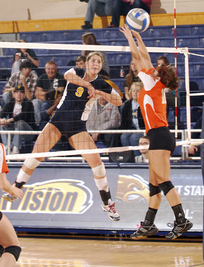 Senior outside hitter Lauren Jones hits the ball between the hands of Bowling Green's defense. Jones scored 8 kills during Friday's victory against Bowling Green, 3-0. Photo by Philip Botta.