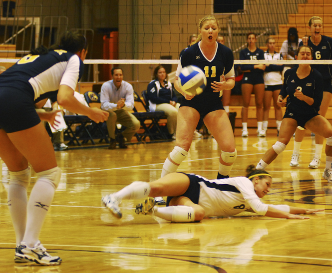 Defensive specialist Kristen Barr dives to save the ball. Photo by Sam Verbulecz.