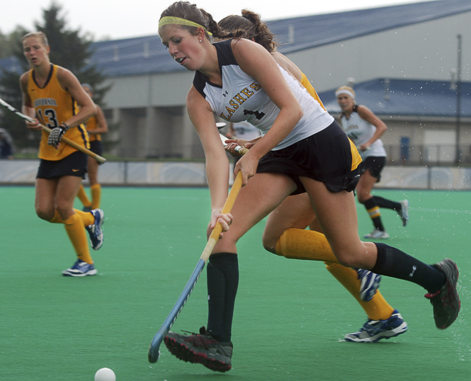 Sophomore Alyssa McFerren carries the ball upfield during the 5-2 loss to California on Monday, Sept. 19. Photo by Matt Hafley.