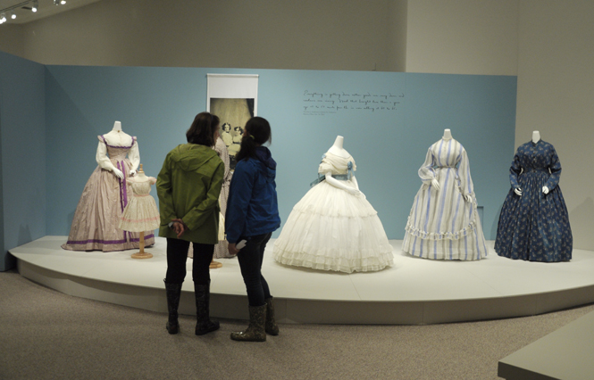 Patter Beldon and her granddaughter Gretchen Parker visit the new On the Home Front Civil War exhibit at the Kent State University Museum. Photo by Amy Loomis.