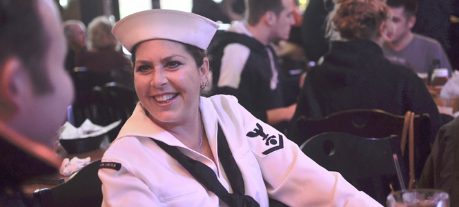 Sue Gabik, of Akron, dressed as a sailor in Ray's restaurant on Wednesday for dinner with some friends, also in costume. The restaurant/bar already has begun to attract a large crowd before the Halloween weekend. Photo by Jacob Byk.