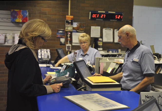 Kent resident Alexa Sandmann and Kent graduate and postal worker Allan Krysiak. Photo by Jenna Watson.