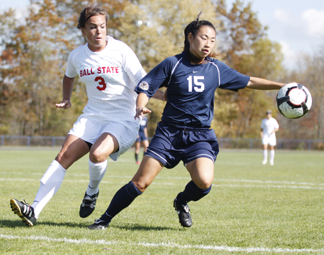 Freshman defense Morgan Mah tries to take possession of the ball against Ball State last season. File photo by Jessica Yanesh.