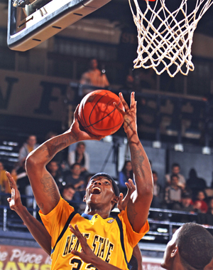 Senior center Justin Manns goes up for a dunk against Shawnee State on Jan. 2. The Flashes beat the Bears 90-65. Photo by Matt Hafley.