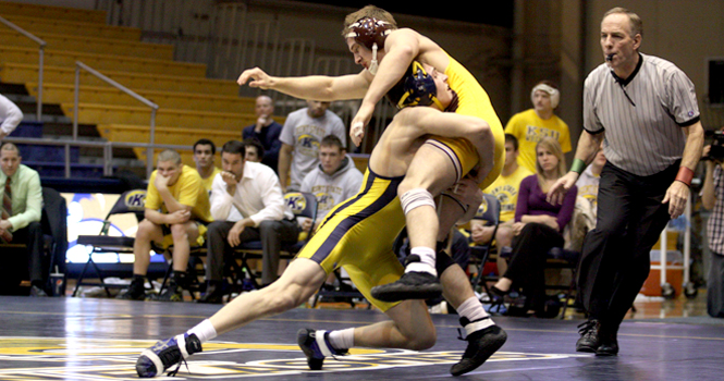 149 lb. Freshman Ian Miller takes down his Central Michigan opponent during the meet on Sunday. Kent State beat Central Michigan 22-13 and remain unbeaten in the Mid-American Conference.