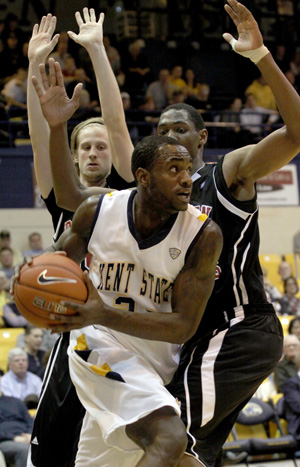 Senior center Justin Manns comes down from a dunk during Kent State’s game against Northern Illinois on Wednesday. Manns contributed six points in the 90-56 victory over the Huskies. Photo by Coty Giannelli.