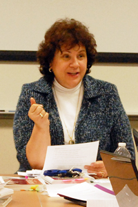 Jan Leach talks with her students during her Newswriting class on Jan. 24. "It's just fun to see the way they grasp a concept or the way they apply things," Leach said. "It's just energizing to me." Photo by Nancy Urchak.