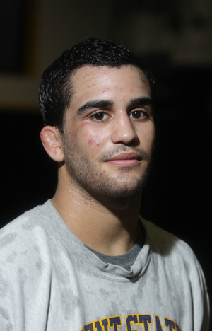 Senior wrestler Stevie Mitcheff stands inside the wrestling training room Thursday evening. Photo by Brian Smith.