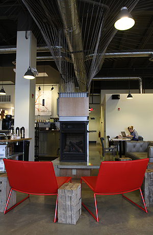 Fireplace surrounded by small reclaimed wooden tables in Tree City Coffee, Feb. 14. Photo by Chelsae Ketchum