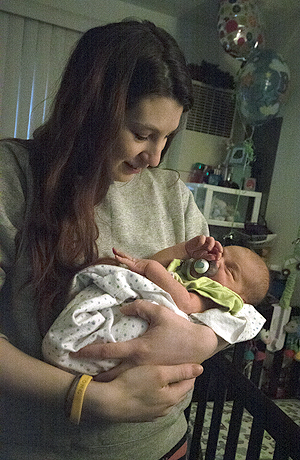 Angela Urchak, a senior advertising major, holds her 2-week-old baby, Rocco. Photo by Coty Giannellli.