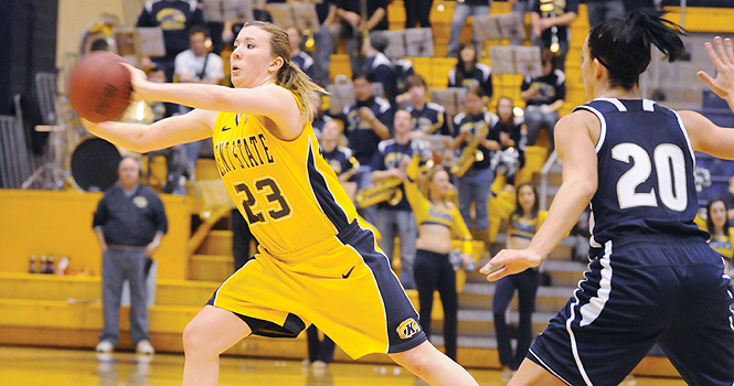 File photo. Freshman guard Jamie Hutcheson passes against Akron on Feb. 25. The Flashes beat the Zips 77-76. The women's team will play Bowling Green Tuesday the 28 at the MAC Center at 7 p.m. Photo by Phillip Botta.