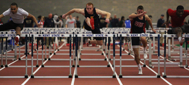 Mike Schober, senior Sports Administration major, competes in the preliminary heat for the Men's 60 meter hurdle.. Photo by Valerie Brown