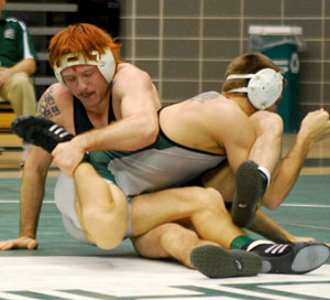 Mallie Shuster, senior 157 weight class, grappled against an Eastern Michigan wrestler on Sunday, Feb 4th at the Ohio University Convocation Center in Athens. Shuster lost his match 2-4. Photo by Sam Verbulecz.