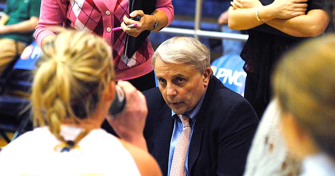 Head coach Bob Lindsay talks to the women's team during a time out at the game against the Miami Redhawks on Wednesday, Feb. 15. Miami defeated Kent State in over time, with a final score of 65-69. Photo by Jenna Watson.