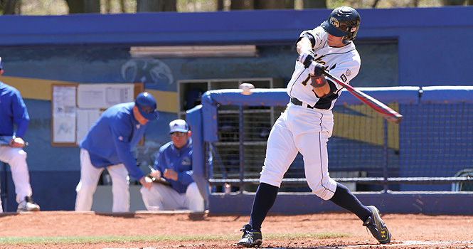 Junior Evan Campbell swings at the pitch during the game against Buffalo, April 7. Photo by Chelsae Ketchum.