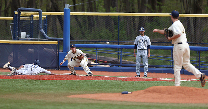 Senior pitcher Ryan Mace attempts to throw out a Pittsburg player with the help of Junior first basemen George Roberts during the Tuesday, April 17 game. The Flashes beat Pittsburg 6-5. Photo by Coty Giannelli.