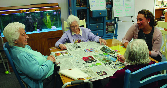 NAEA vice president Krystin Smith converses with residents of Haven Homes. Photo by Rachel Campbell.