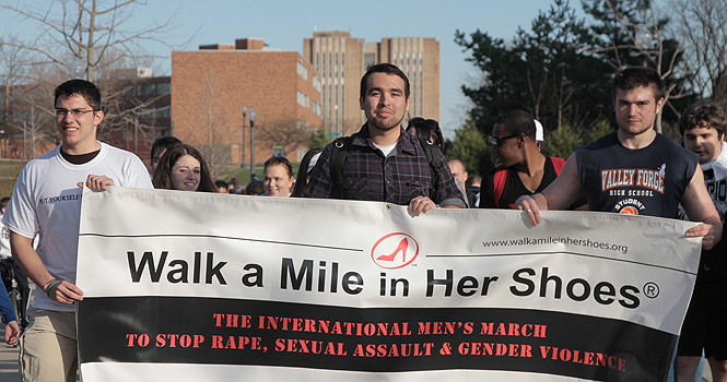 Students participate in last year's Walk a Mile in Her Shoes. File photo by Rachel Kilroy.