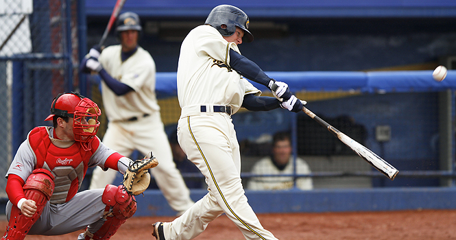 Sophomore outfielder T.J. Sutton makes contact with a pitch against Youngstown State at Schoonover Stadium on Wednesday, April 11. Kent State defeated Youngstown State 14-4. Photo by Anthony Vence.