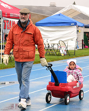 Robert Cargile and Maya Cargile walk at the Relay for Life walk, April 21. They walked in honor of Robert's father who lost his life last year to cancer. The walk was held at Kent State's running track. Photo by Emily Martin.