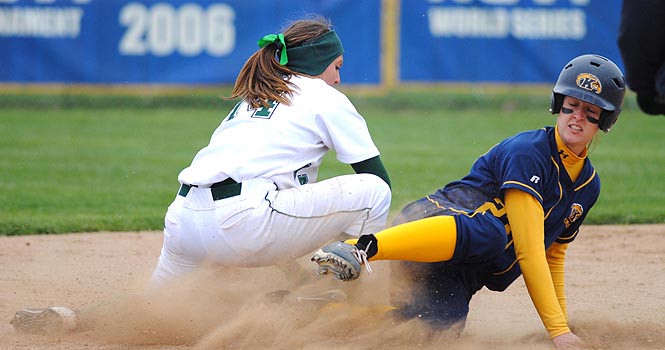 Senior Mary Holt made a safe slide into second during the Flashes' game against Eastern Michigan on Saturday, March 31. Kent State won with a final score of 6-1. This was the team's fourth consecutive win of the season. Photo by Jenna Watson.