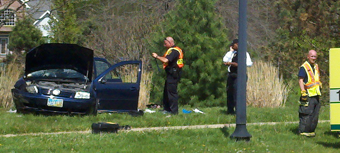 Police investigate a rollover car accident that occurred near Kent Roosevelt High School. Photo by Rachel Kilroy.