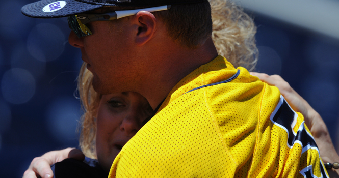 “I’m very proud of him,” said Mari Sutton, mother of T.J. Sutton, as she hugs her son holding back the tears after the Flashes' second and final loss at the College World Series in Omaha, Neb., Thursday, June 21. Photo by Philip Botta.