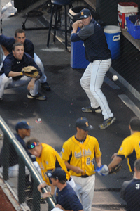 Members of the Kent State University baseball team play invisible baseball during the rain delay at TD Ameritrade Park in Omaha, Neb., Wednesday, June 20. The game was later canceled due to thunderstorms that would continue for most of the night. Photo by Philip Botta.