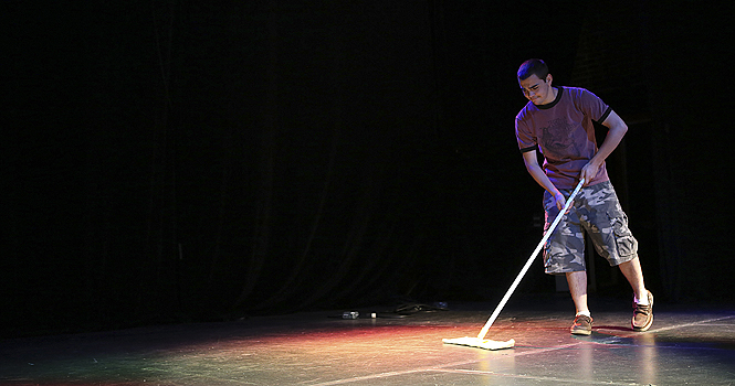 Ethan Simpson sweeps the stage at the Kent Stage on Tuesday. The Kent Stage celebrated it's 10-year anniversary in January 2012. Photo by Coty Giannelli.