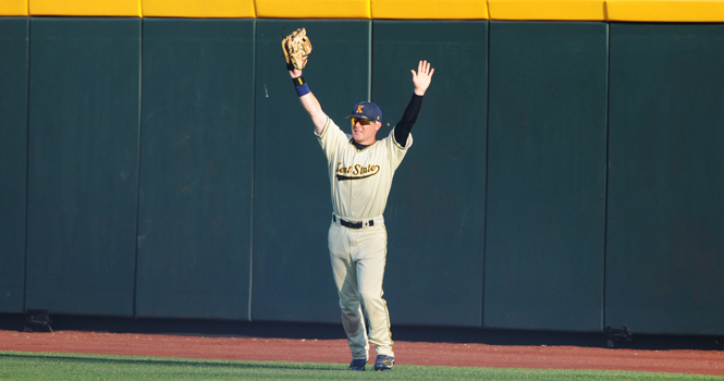 Right fielder T.J. Sutton stands proudly after catching the last ball of the game securing the Flashes first victory over Florida, 5-4, in the College World Series in Omaha, Neb., Monday, June 18 at TD Ameritrade Park. . Photo by Philip Botta.