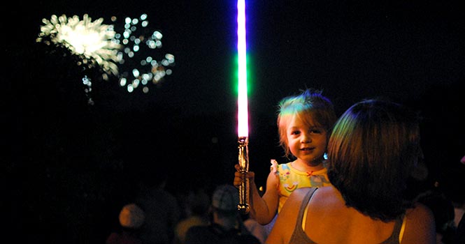 Zoie Duncan, 2, of Kent, enjoys fireworks at the Kent Heritage Festival with her family on Saturday, July 7. Photo by Jenna Watson.