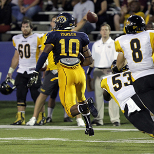 Kent State's Andre Parker recieves a muffed punt and runs in the wrong direction on the field during the first football game of the season, Thursday, August 30. Photo by Phil Botta.