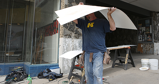 Jay Blaker works on Jimmy John’s new store location near the Kent Stage. The restaurant is scheduled to reopen Friday. Photo by Coty Giannelli.