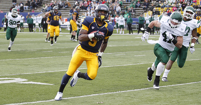 Junior wide receiver Tyshon Goode attempts to run the ball into the end zone during the Flashes' last regular season game at Dix Stadium on Saturday, Nov. 19. Goode's 4th quarter touch down put the Flashes ahead 28-22 and allowed them to defeat Eastern Michigan. File photo.