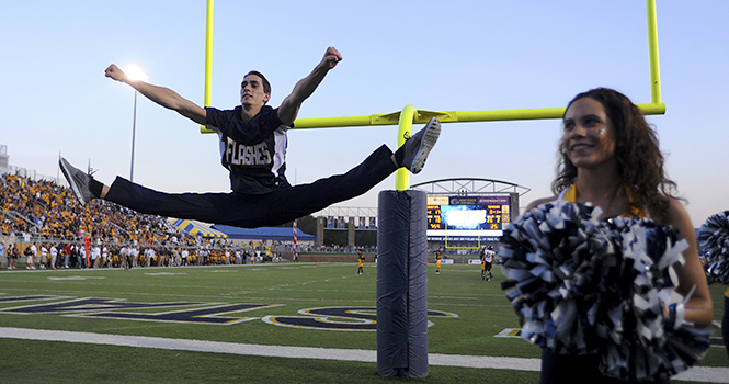 Sophomore dance team member, Liam Rogers dances at his first football game on Thursday, August 30 at the Kent State vs. Towson football game. Rogers is the first male member of the Kent State dance team. Photo courtesy of the Record-Courier.