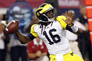 Michigan quarterback Denard Robinson throws and completes a pass against Alabama in the first half of the Cowboys Classic at Cowboys Stadium in Arlington, Texas, Saturday, September 1, 2012. Photo by (Julian H. Gonzalez/Detroit Free Press