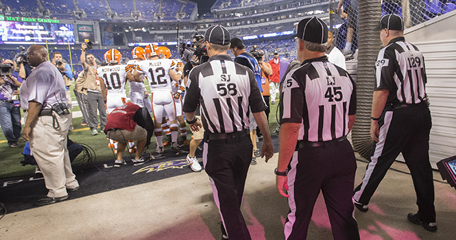 Side judge Jimmy DeBell (58), line judge Jeff Seeman (45), and umpire Bill Schuster (129) take to the field before their first game back after a lockout. They're ready to officiate the game in Baltimore, Maryland, on Thursday, September 27, 2012, between the Ravens and Cleveland Browns. Photo courtesy of MCT Campus.