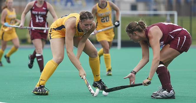 Sophmore Shannon Martin tries to dribble it past a Lock Haven defender during the game on September 9. The Flashes' second-half rally was not enough to win the game, losing 4-2. File photo.