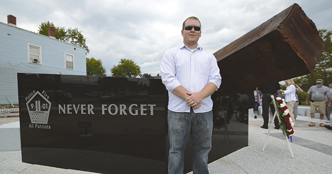 Michael Work, Kent State architecture graduate, was the main designer for the Police and Fire All Patriots 9/11 Memorial in Tiffin, OH. The memorial features a steel beam that was part of one of the World Trade Center buildings, which is angled on a pentagon-shaped base at 9.11 degrees. The memorial, located at the intersection of N. Washington St. and Frost Pkwy, was dedicated on Sunday, Sept. 9 after a solemn progression by Tiffin police and firefighters from St. Joesph's Church. Photo by Matt Hafley.